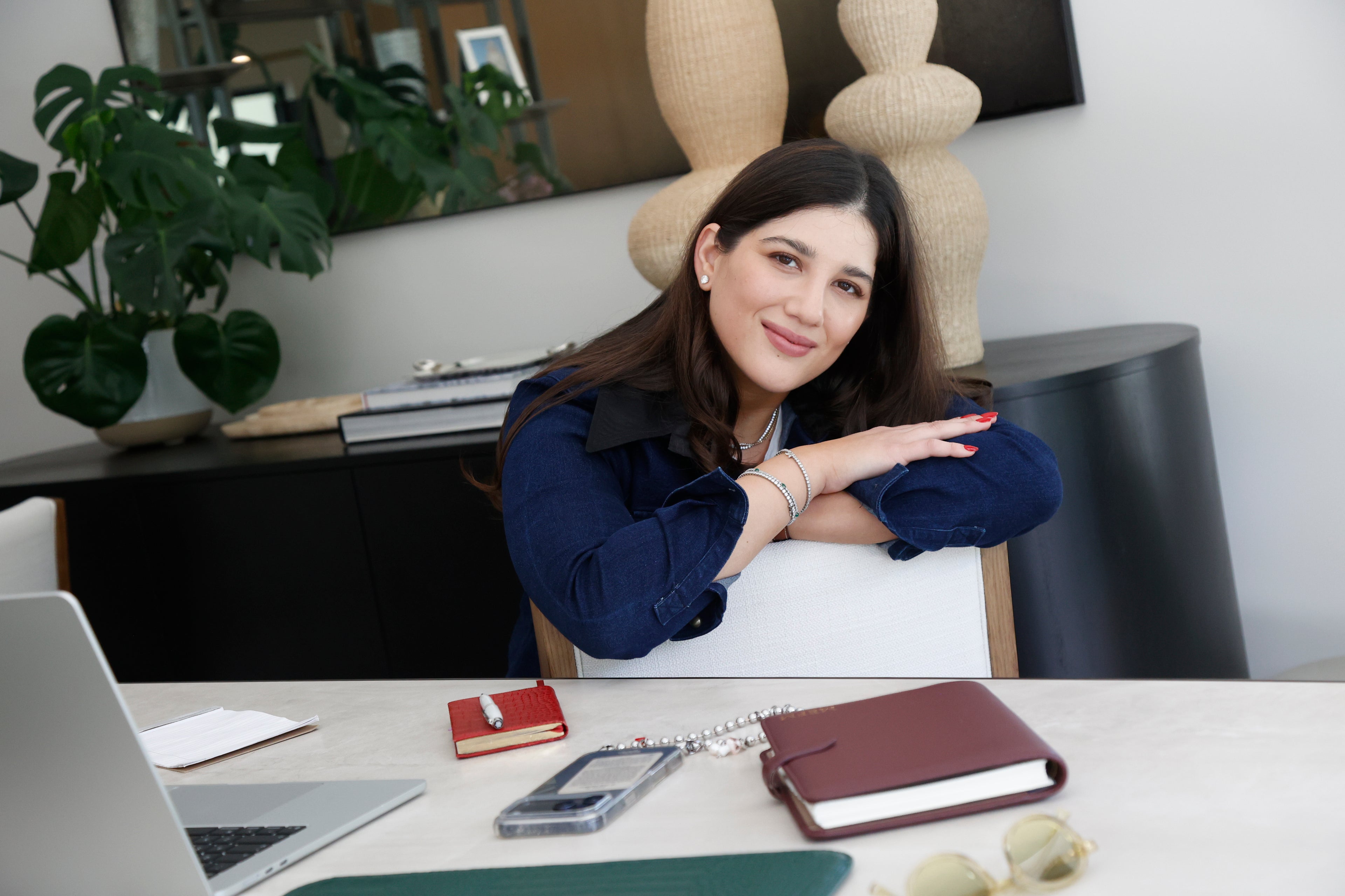 Maria Elisa Franco, founder of MEF Strategy, at her desk — senior marketing strategist and e-commerce consultant for small brands.