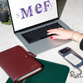 MEF STRATEGY LOGO open computer, planner, cellphone iphone